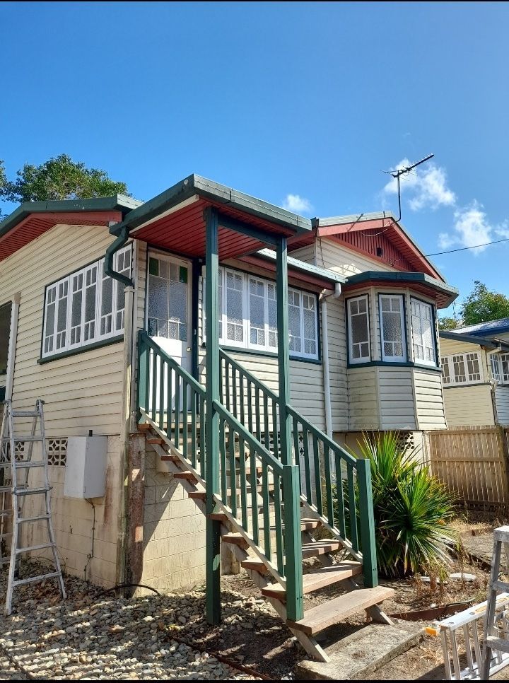 A White House With Green Stairs Leading Up To It — Kiwi Painter In Mooroobool, QLD