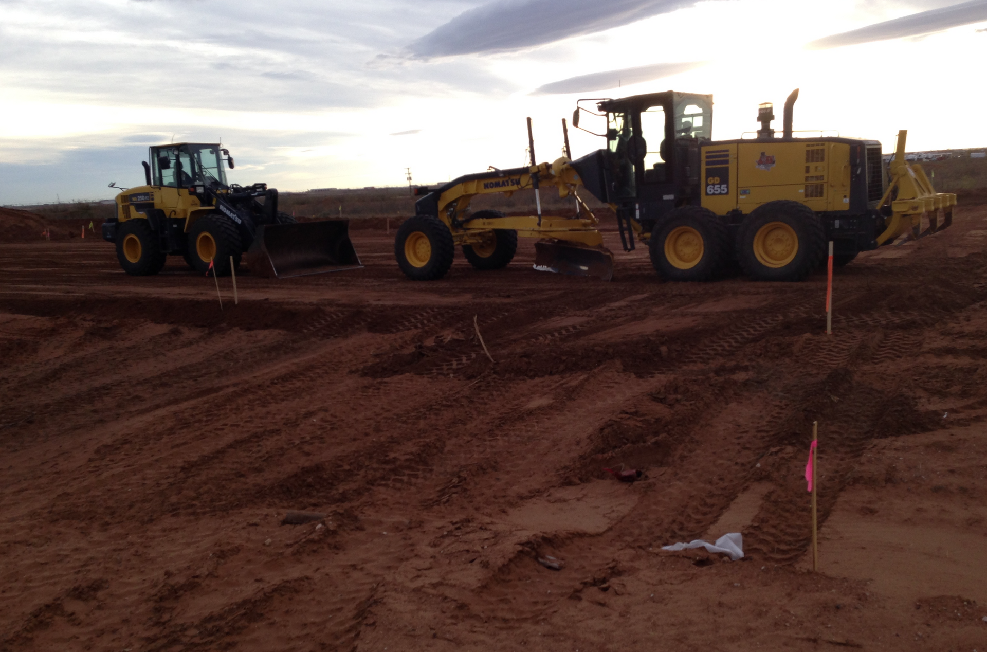 A bulldozer is moving dirt on a construction site.