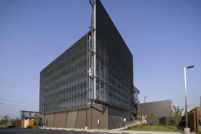 A large building with a blue sky in the background
