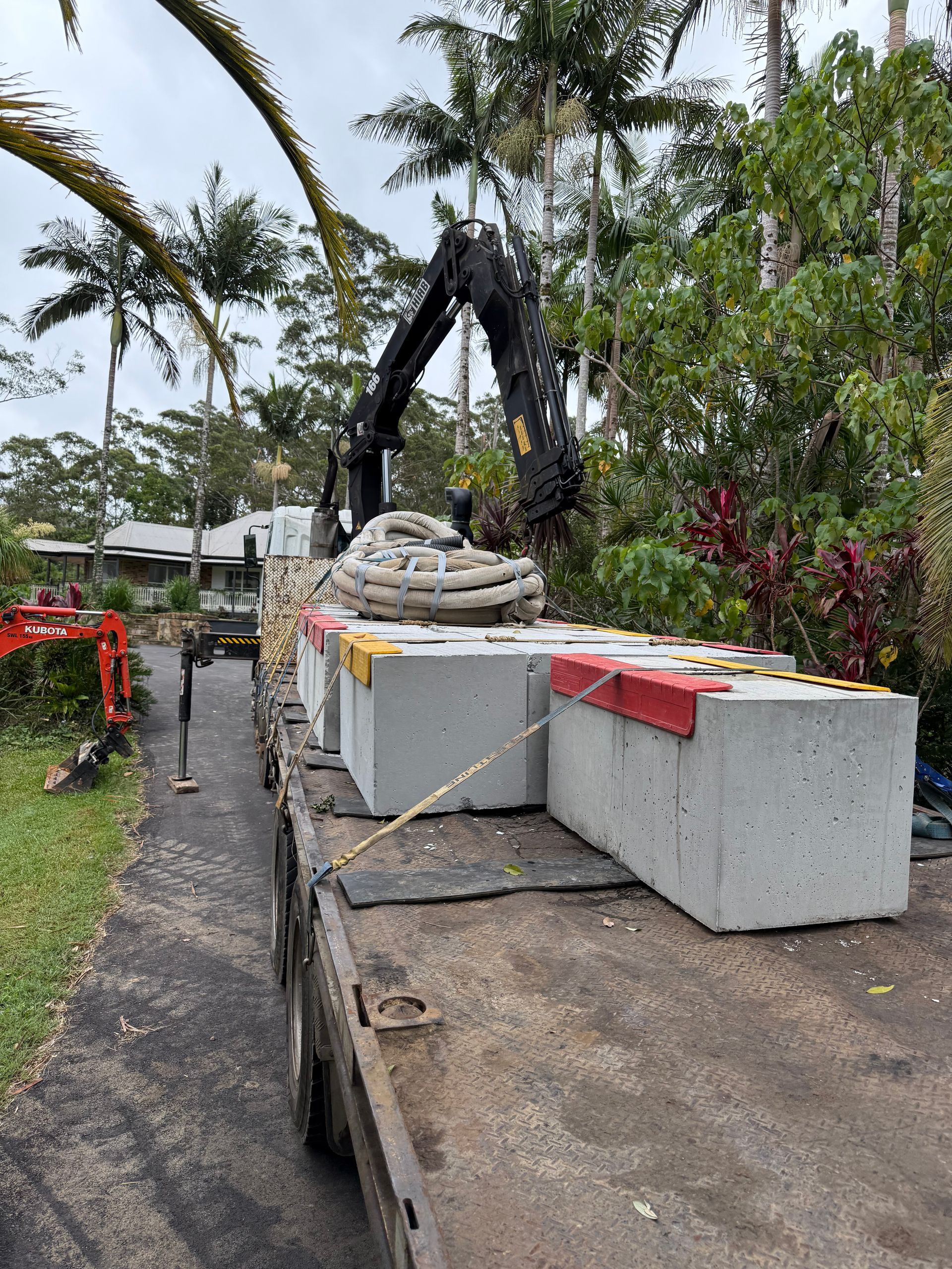 A Crane Truck with Concrete Blocks on the Back— Brodees Crane Trucks in Burleigh, NSW