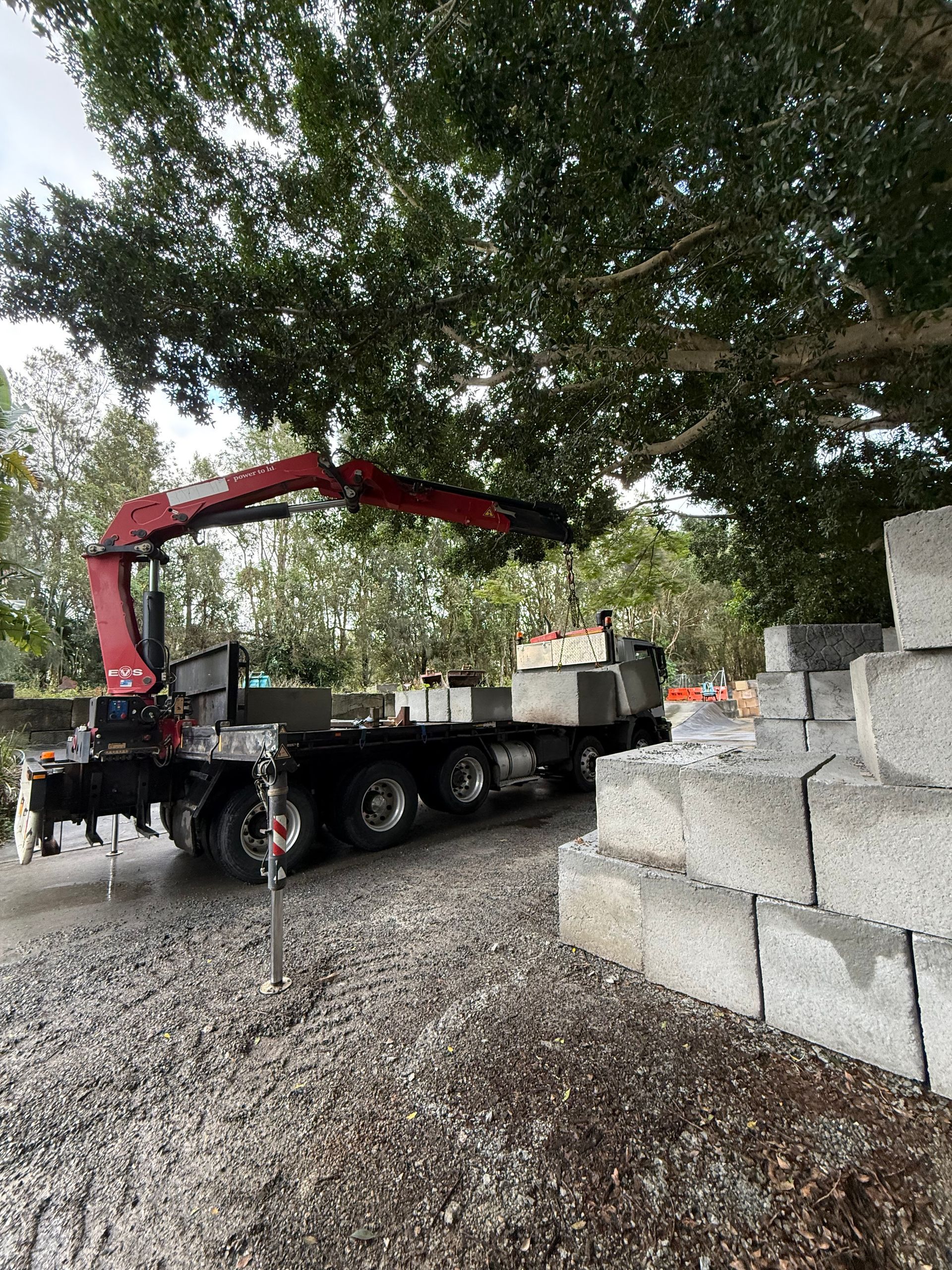 A Crane Truck Has Concrete Blocks On The Back — Brodees Crane Trucks in Murwillumbah, NSW