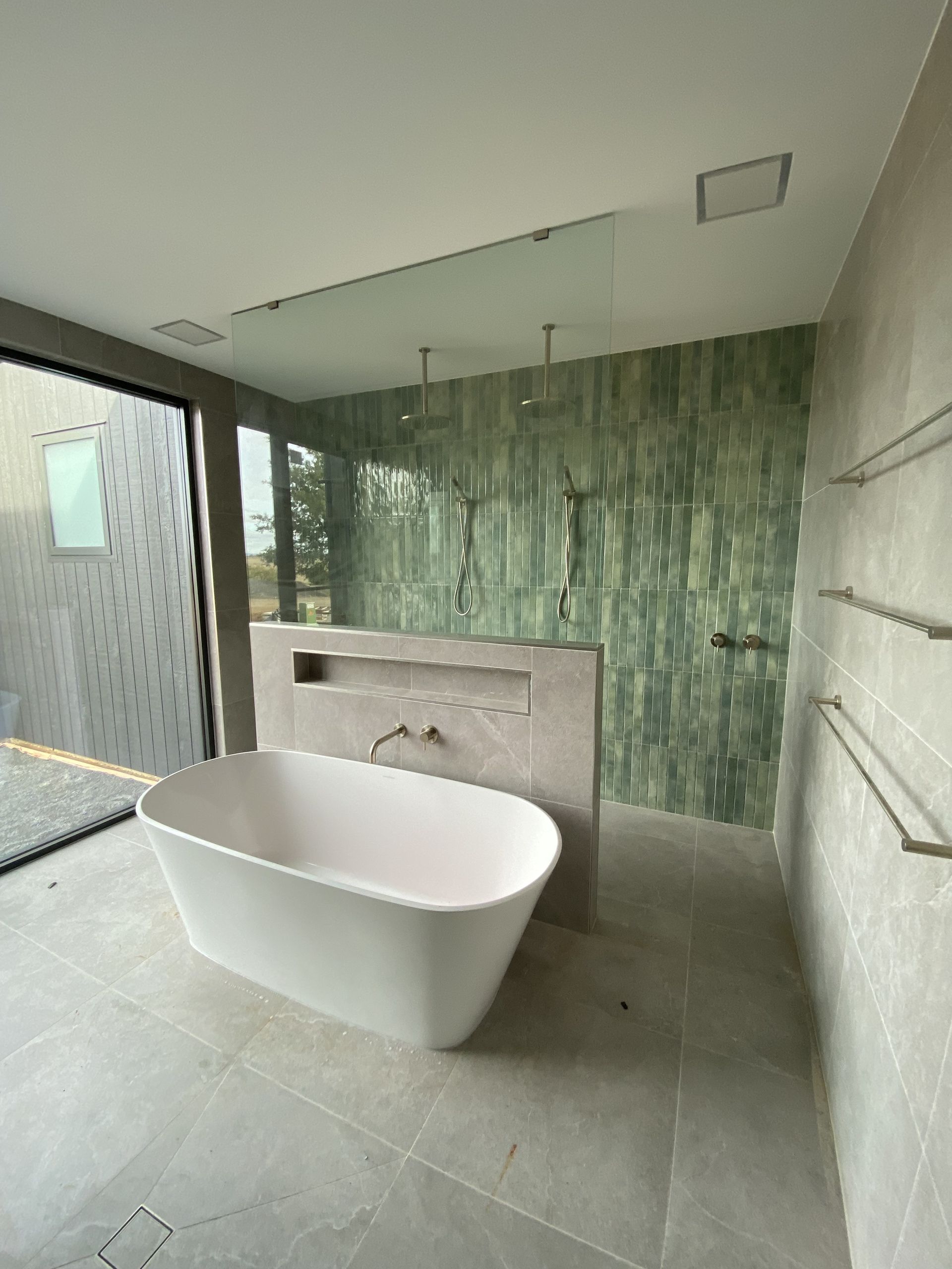 Modern Bathroom With White Freestanding Tub — Rectified Edge Tiling & Bathroom Renovations in Yass, NSW