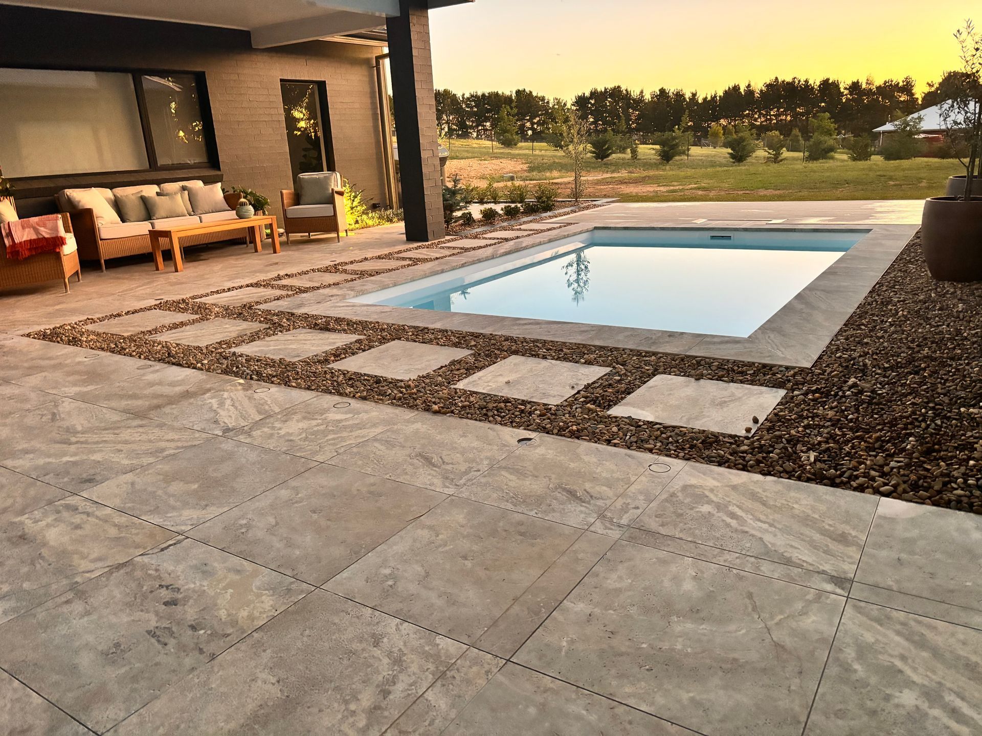 Poolside Patio With Pool — Rectified Edge Tiling & Bathroom Renovations in Goulburn, NSW