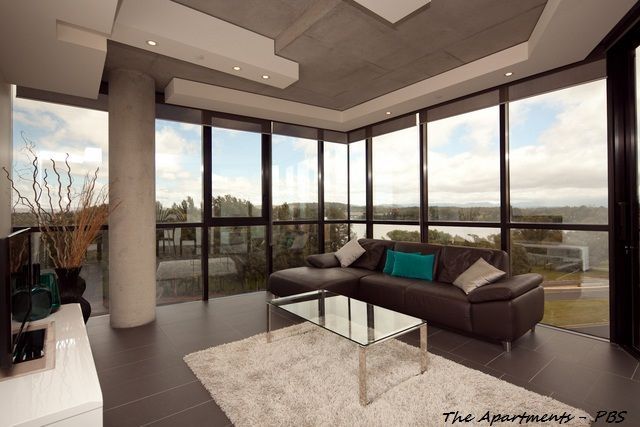 Modern Living Room With Floor-to-ceiling Windows — Rectified Edge Tiling & Bathroom Renovations in Jamison Centre, ACT