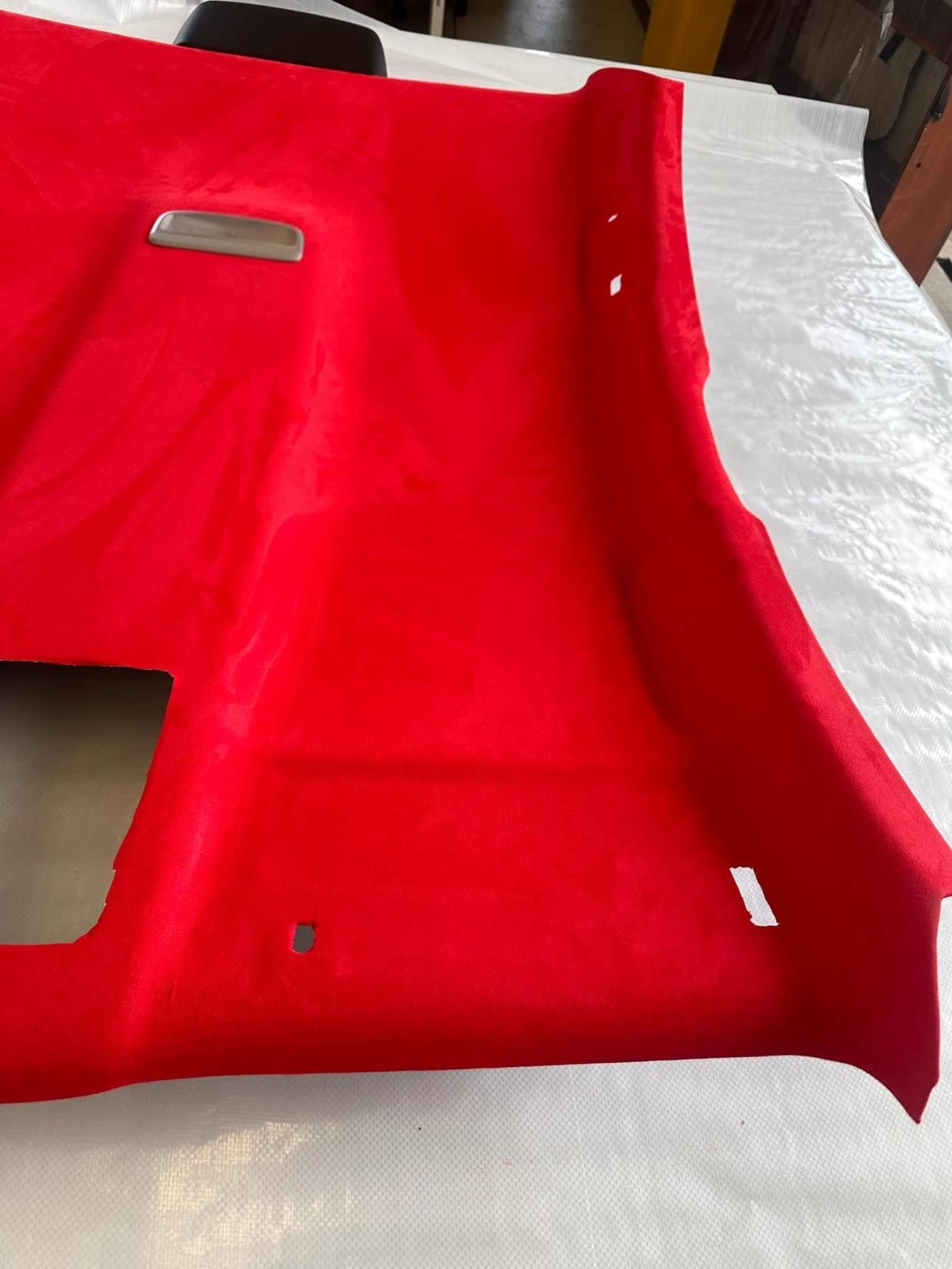 A Red Ceiling Is Sitting On Top Of A White Table — All Car Upholstery In Pinelands, NT