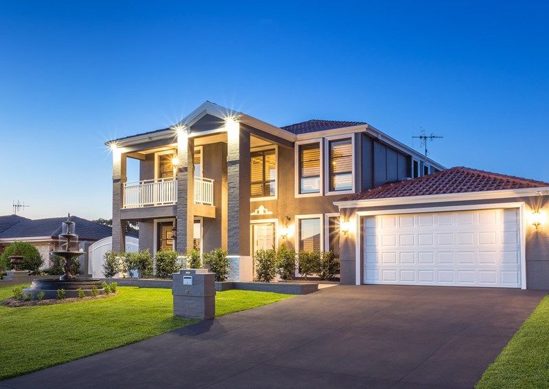 A Large two story house with a driveway — Commercial Painting Group in Kembla Grange, NSW