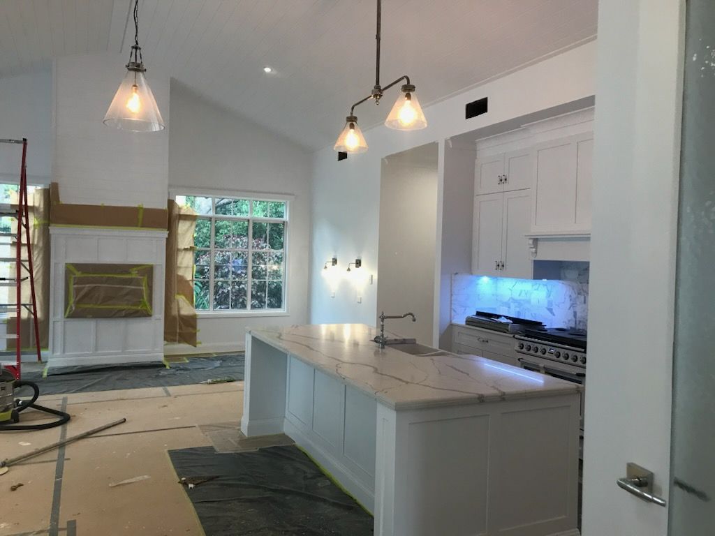A Modern House With a kitchen and hanging lights — Commercial Painting Group in Goulburn, NSW