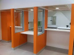 Orange walls and white benches — Commercial Painting Group in Kembla Grange, NSW