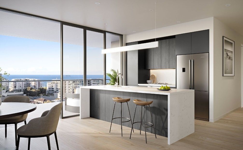 A kitchen with an island bench and two stools overlooking a city — Commercial Painting Group in Kembla Grange, NSW