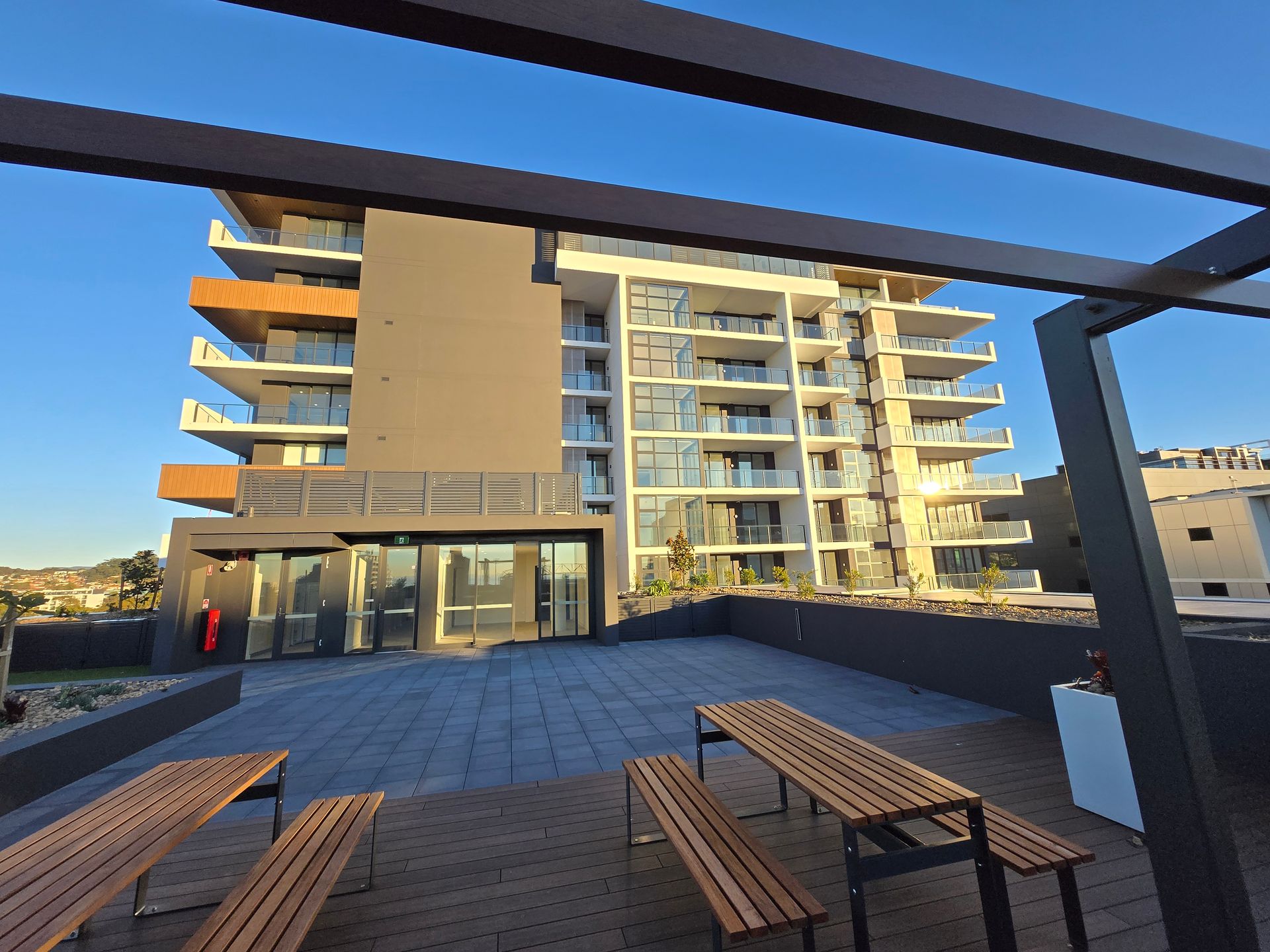 An outdoor area looking at an apartment block — Commercial Painting Group in Kembla Grange, NSW