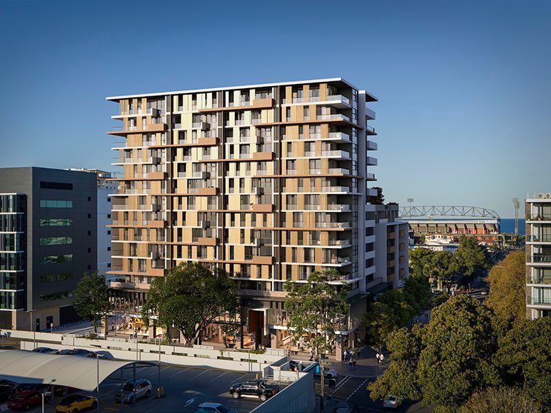 A large apartment building surrounded by trees — Commercial Painting Group in Kembla Grange, NSW