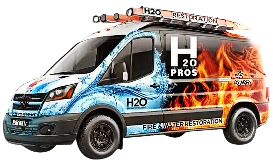 A h2o restoration pros van with a ladder on top of it.