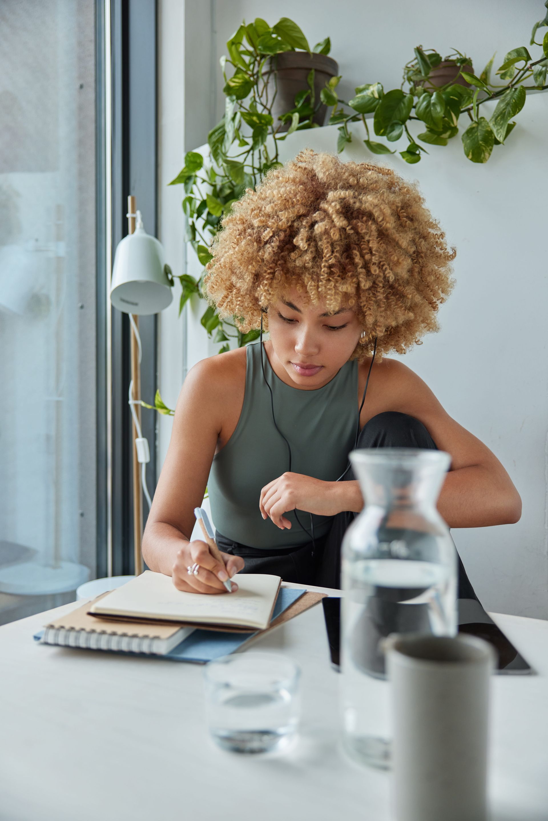 Person journaling at a desk, representing DBT skills practice and emotional regulation at Minisink