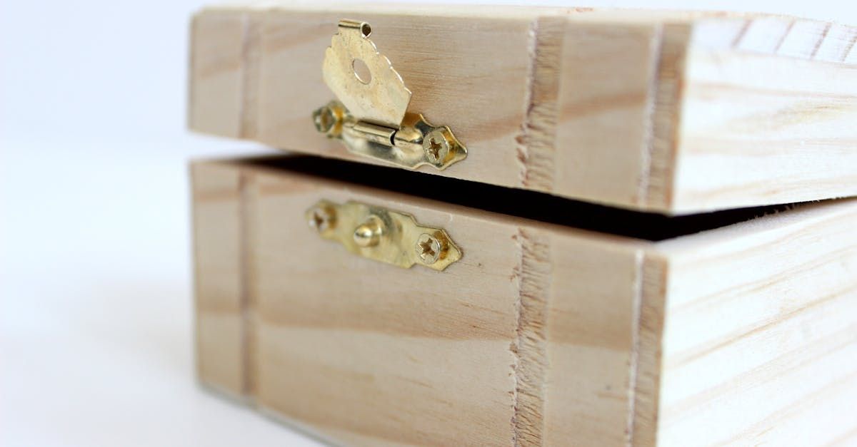 Wooden box, slightly open, with a brass latch.