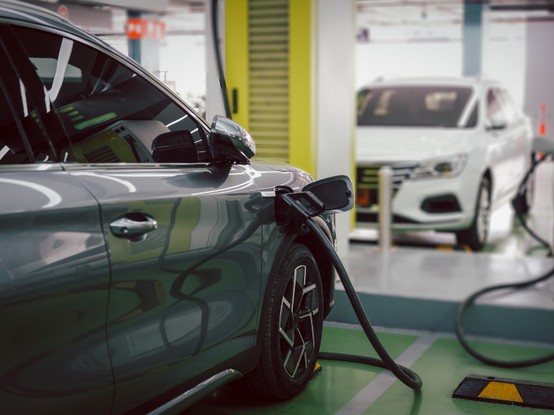 an electric car is being charged at a charging station