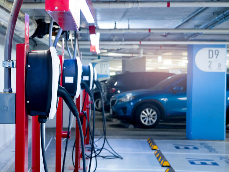 a parking garage with a electric vehicle charging stations