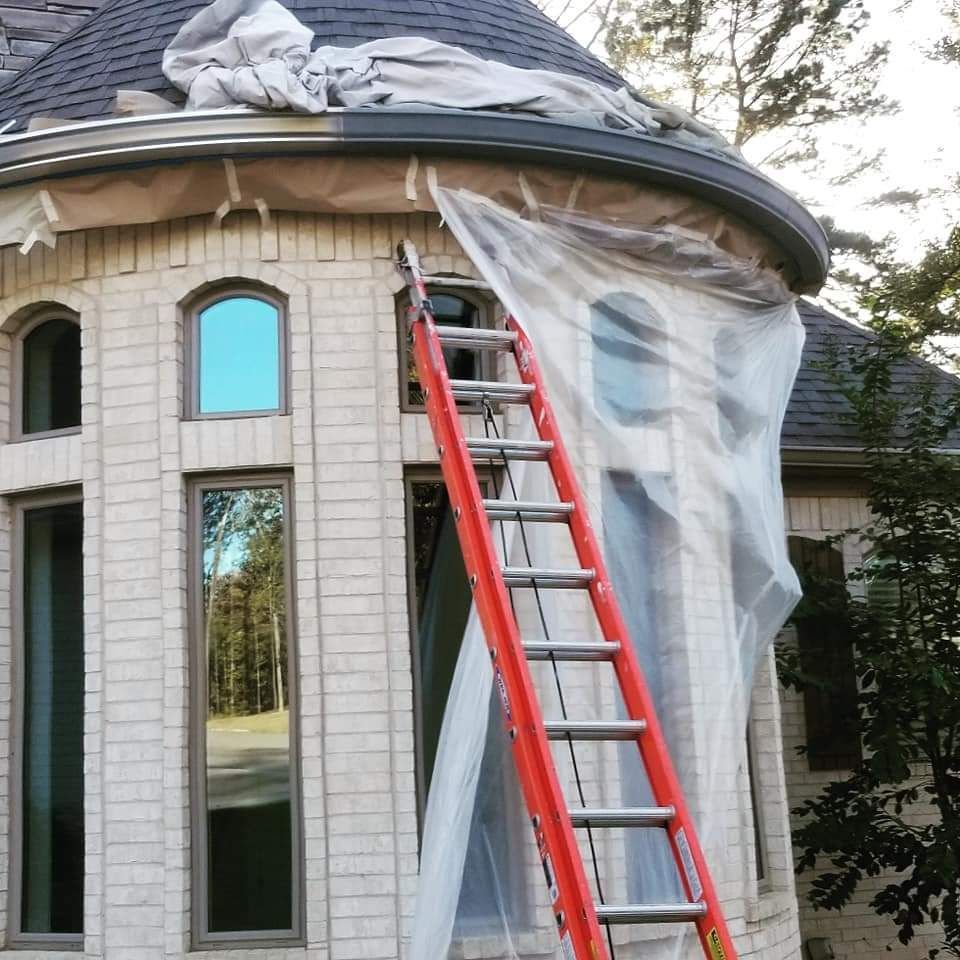 A ladder is attached to the side of a house