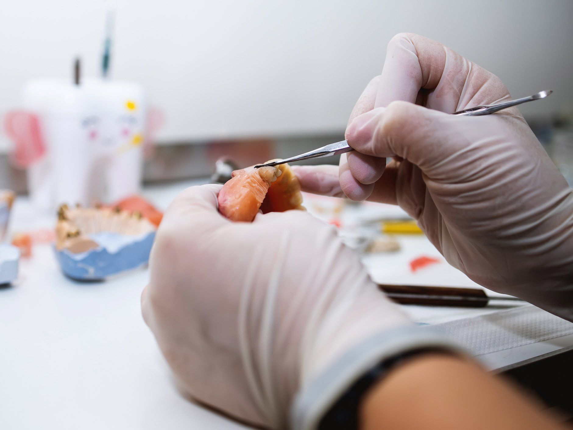 Shaping a prosthesis tooth | Ringwood, VIC | Abstract Arch Denture Clinic