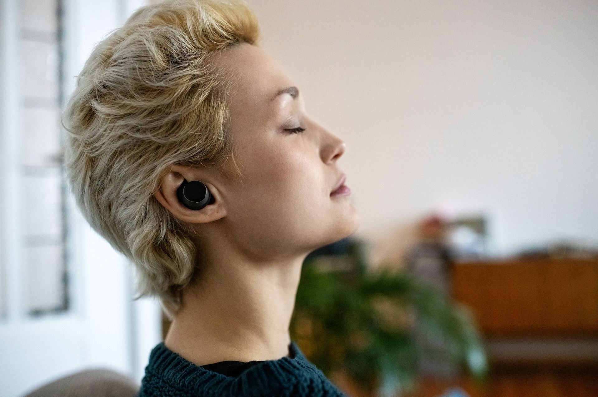 A Hand Holding Hearing Aid — Brooklyn, NY — Urban Hearing