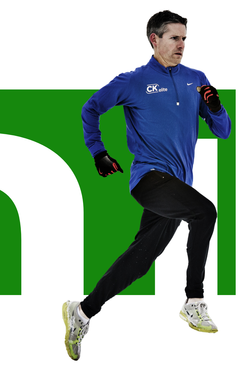 A man in a blue shirt and black pants is running on a green background.