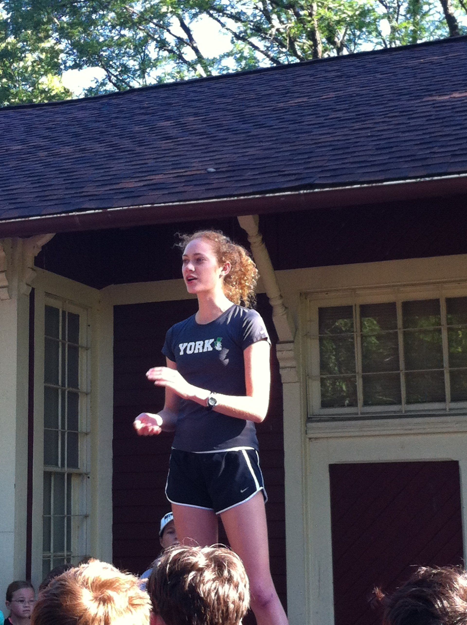 A girl wearing a t-shirt that says ' york ' on it