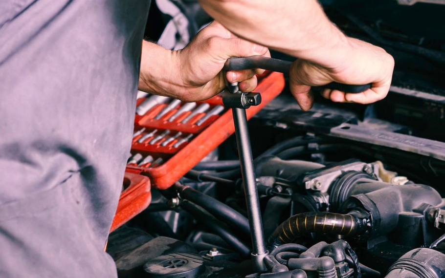 Organized mechanic’s tool kit with sockets, wrenches, and ratchets in foam-lined cases.