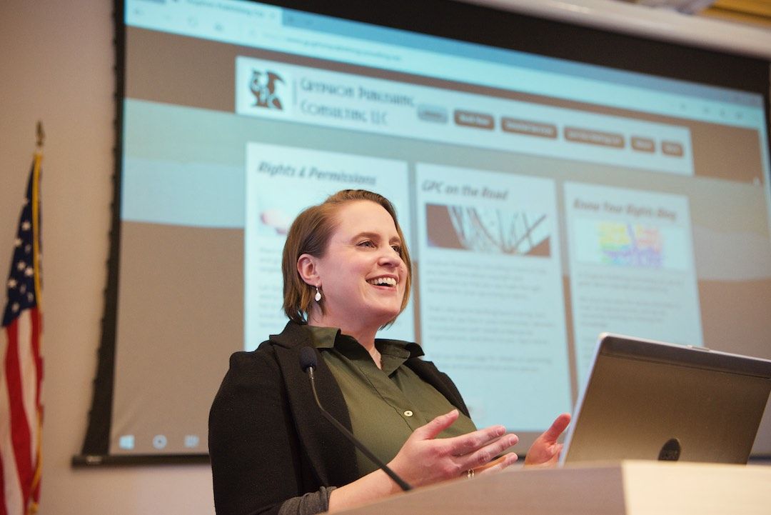 Image of Principal Consultant, MJ, speaking to a class she is teaching about permissions rights.
