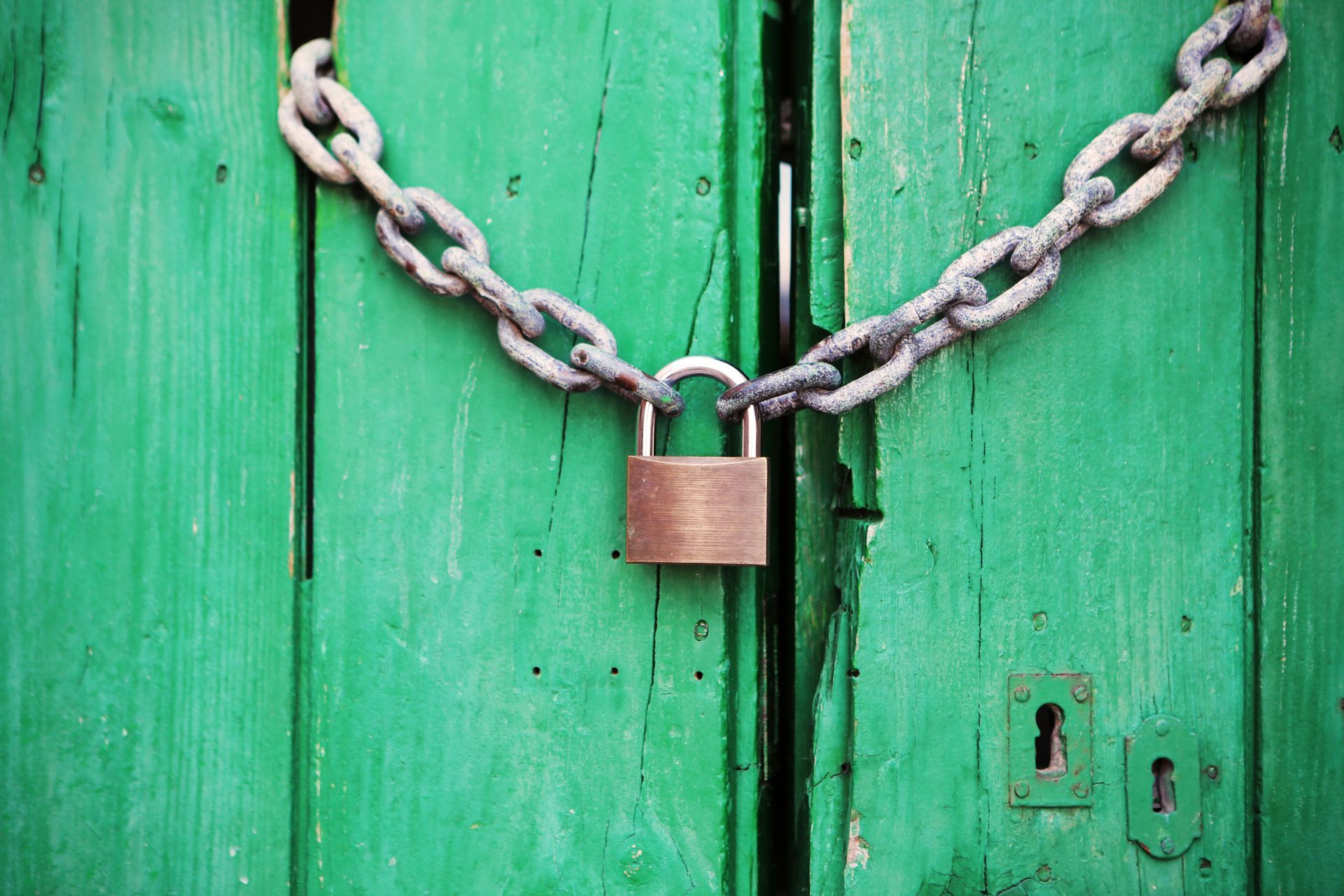 Image of a lock and chain hanging on a door