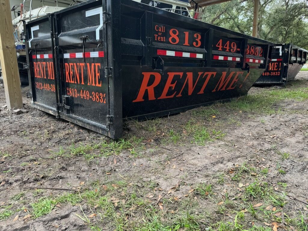 Black dumpster with orange 