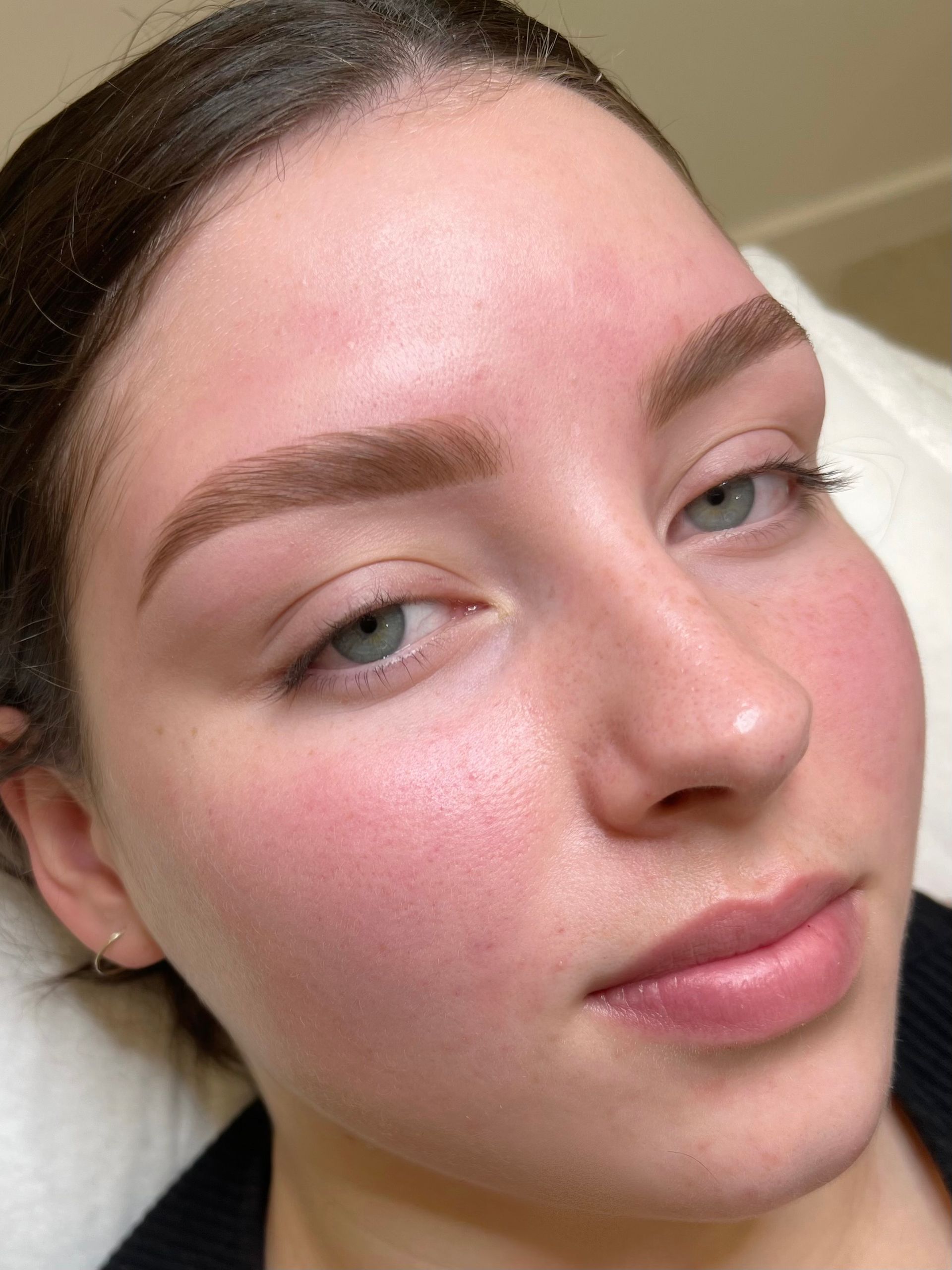 Woman With Light-brown Eyebrows, Flushed Cheeks, and Pale Lips — Isola Beauty in Corrimal, NSW