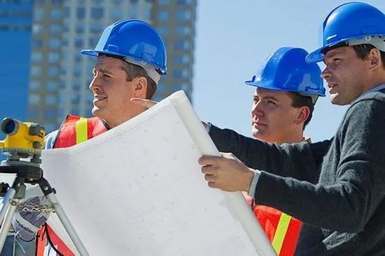 construction workers in blue hard hats 