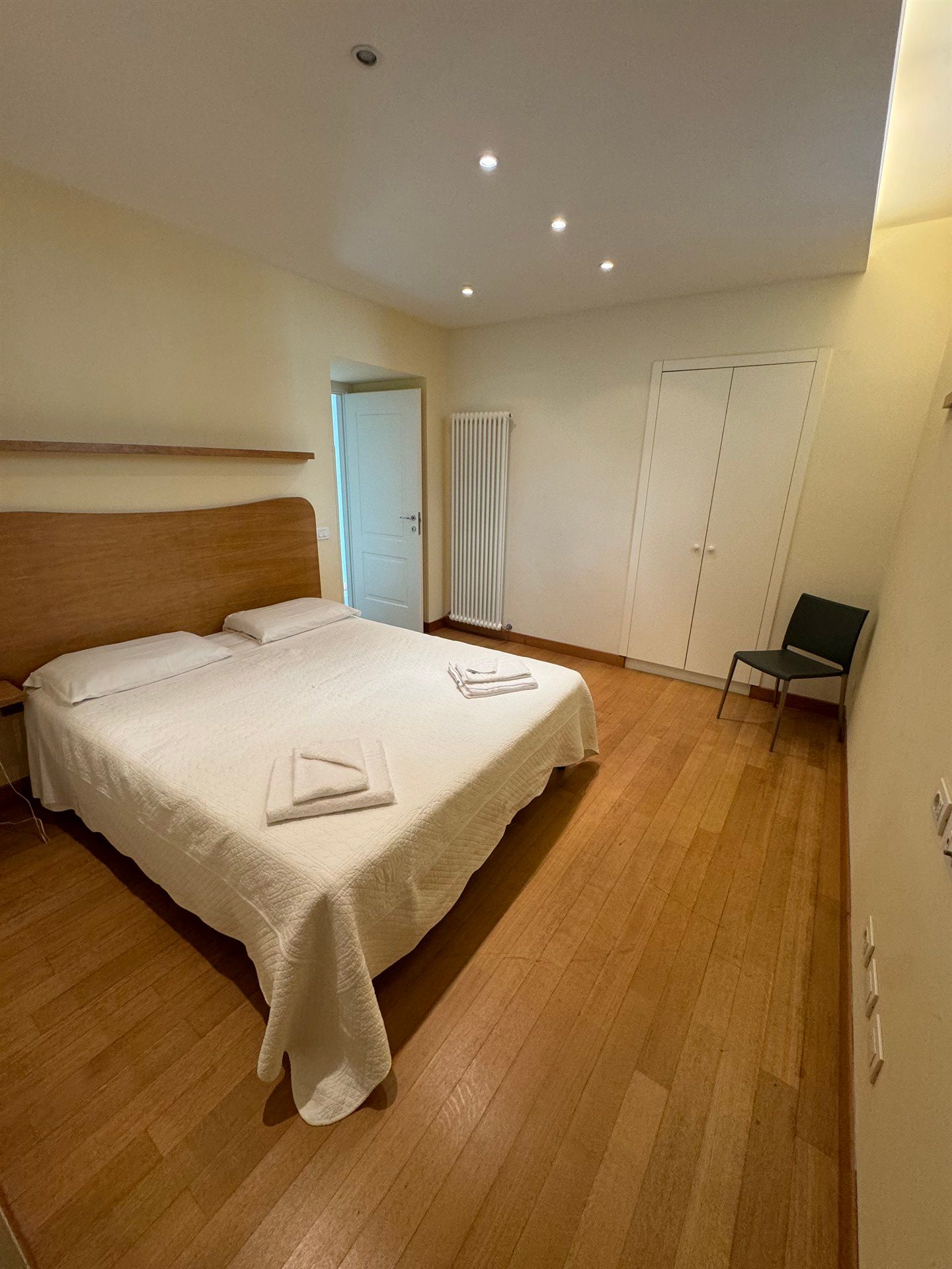 There is a large bed in the middle of the room.