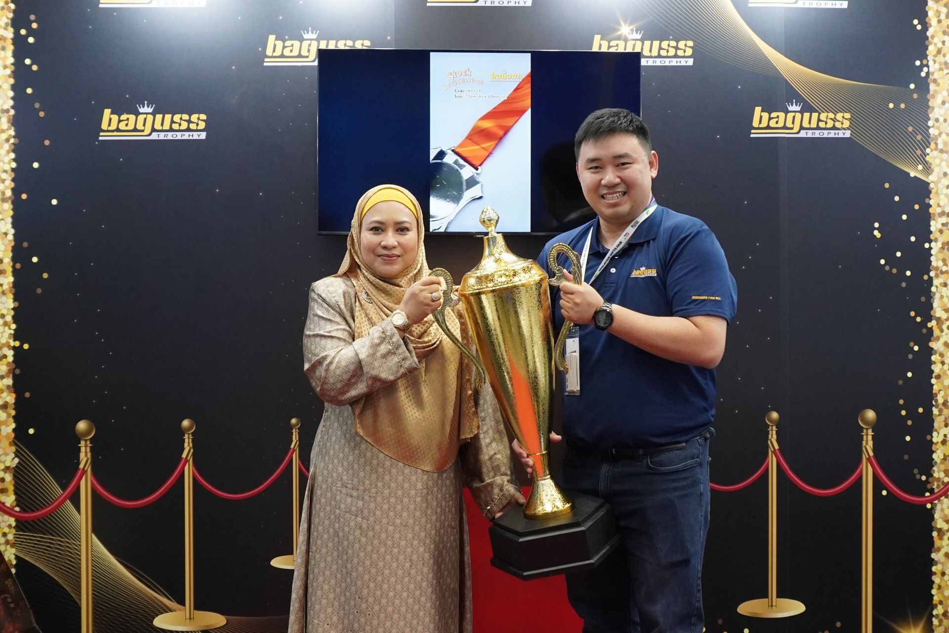 Tengku Adena visited our booth and took a photo with our Director holding a giant luxury trophy at MGF2025.