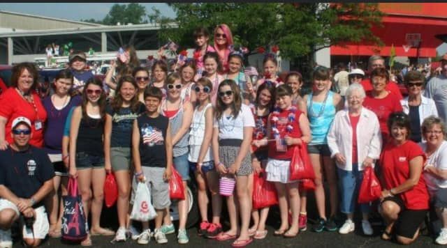 A large group of people are posing for a picture