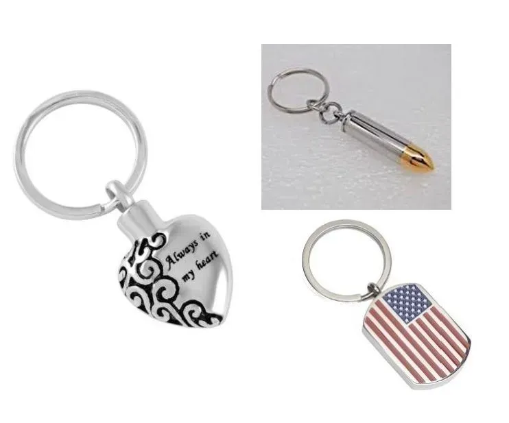 Three decorative keychains: silver heart, clear capsule, and American flag designs.