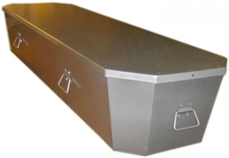 Brown and silver metal coffin with side handles, viewed at an angle