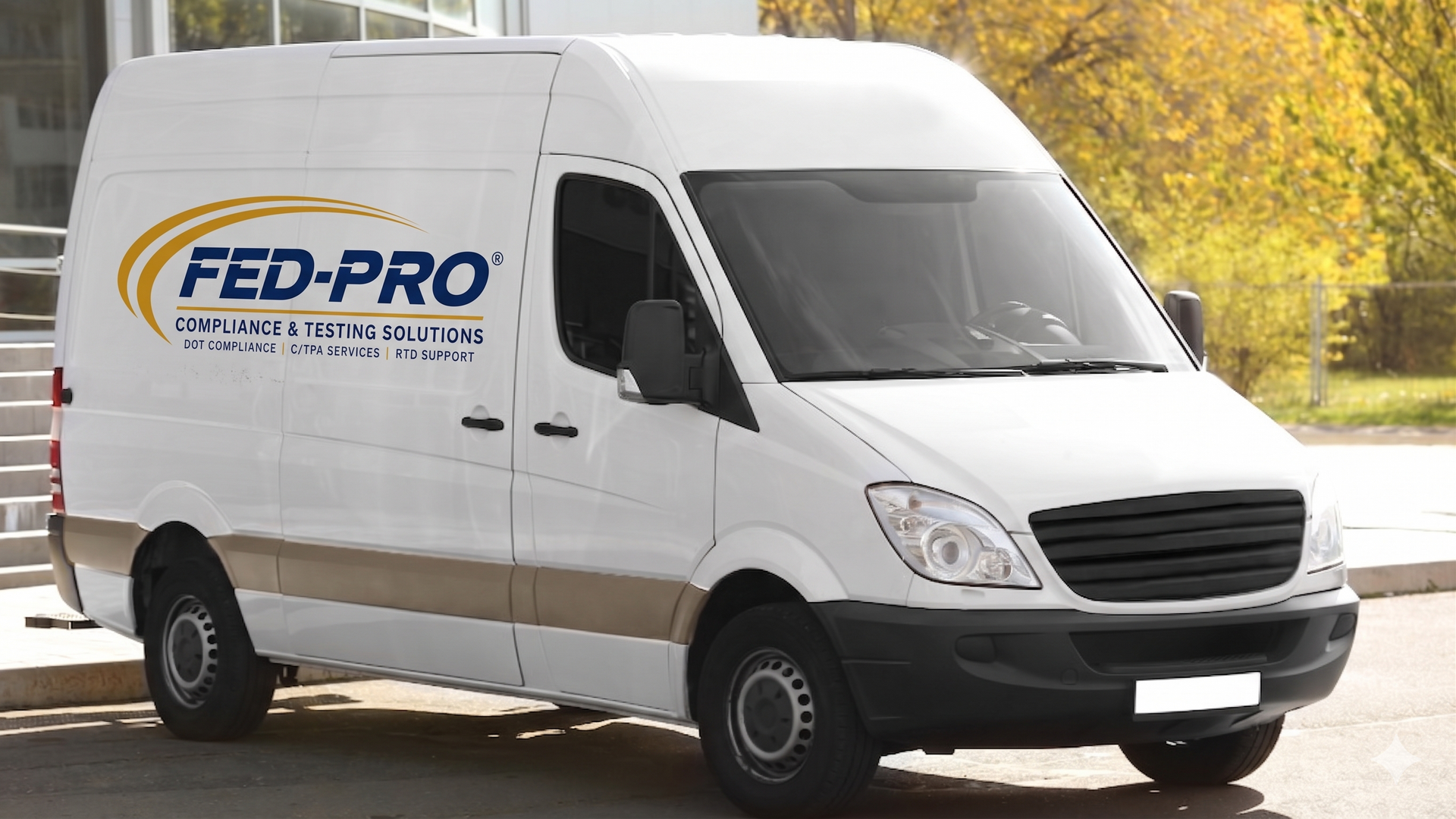 White Fed-Pro delivery van parked outdoors on a road, with trees in the background