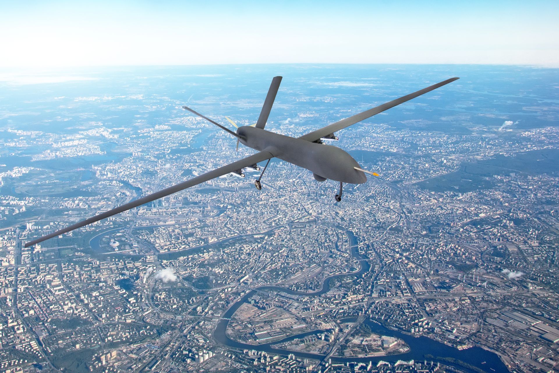 Drone aircraft flying above a city.