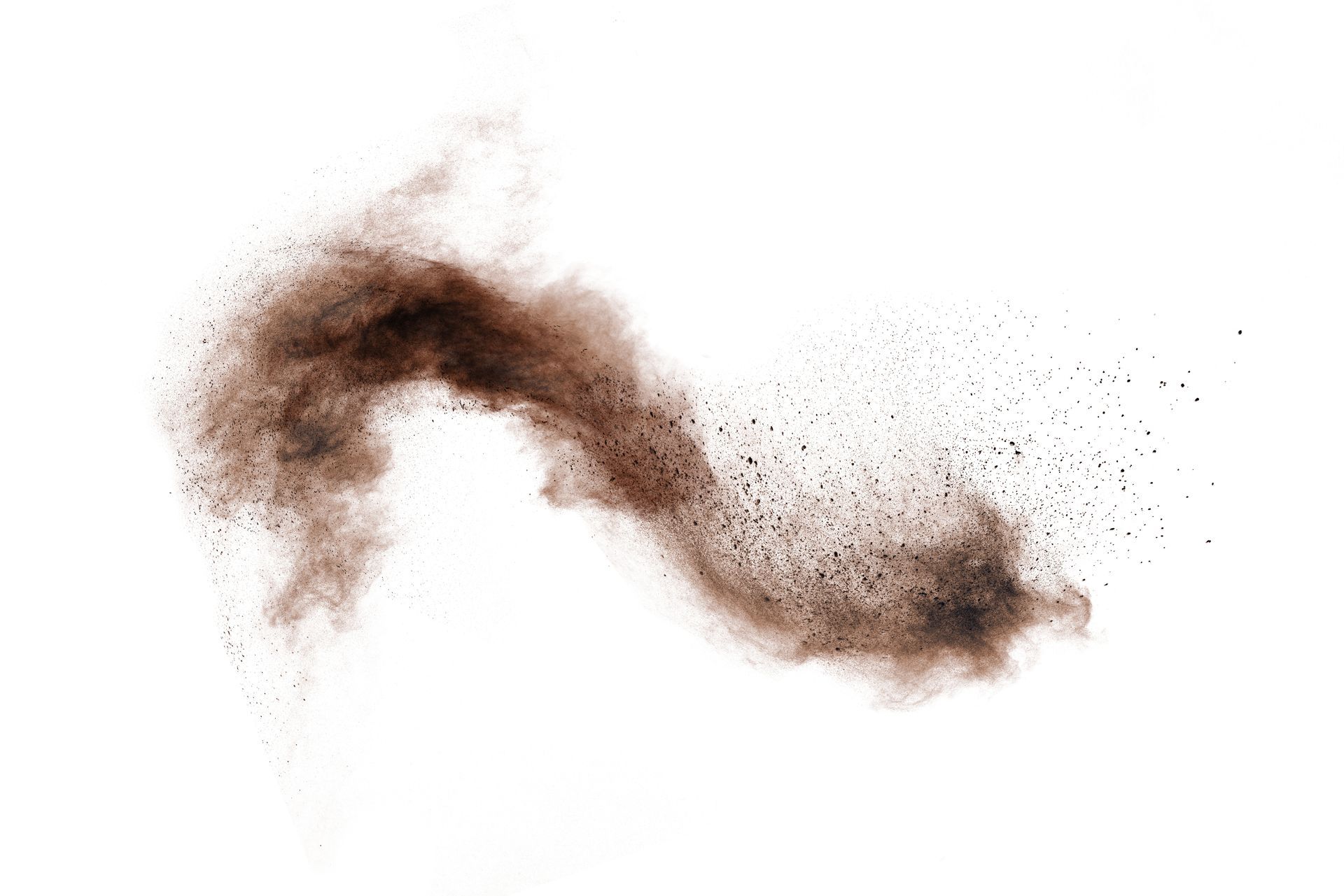 Brown dust explosion on white background.