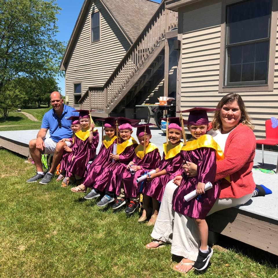 Cap and gown graduation at pre-school.