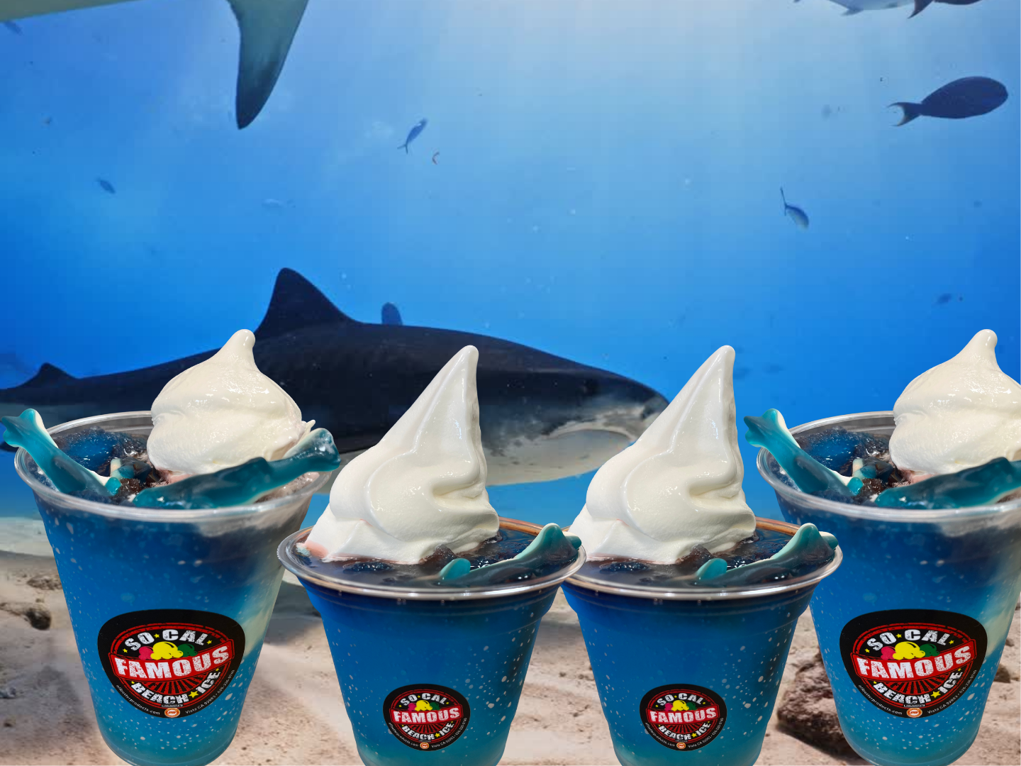 Four plastic cups filled with blue slushy, topped with soft-serve ice cream, sit before a backdrop of swimming sharks.