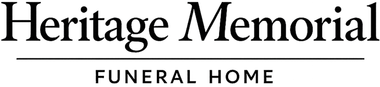 Heritage Memorial funeral home logo in black text with a horizontal line underneath.