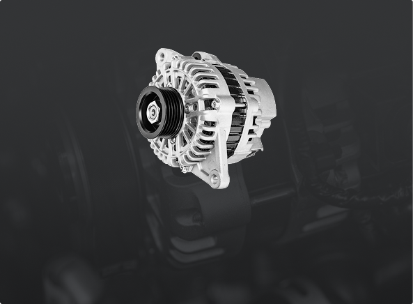 A silver automotive alternator with a black pulley, isolated against a dark gray, out-of-focus background.