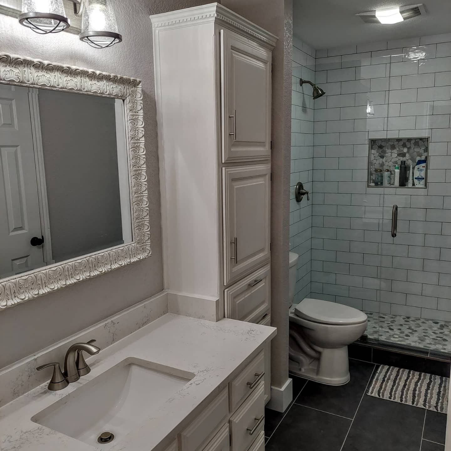 a bathroom with a sink , toilet , and mirror .