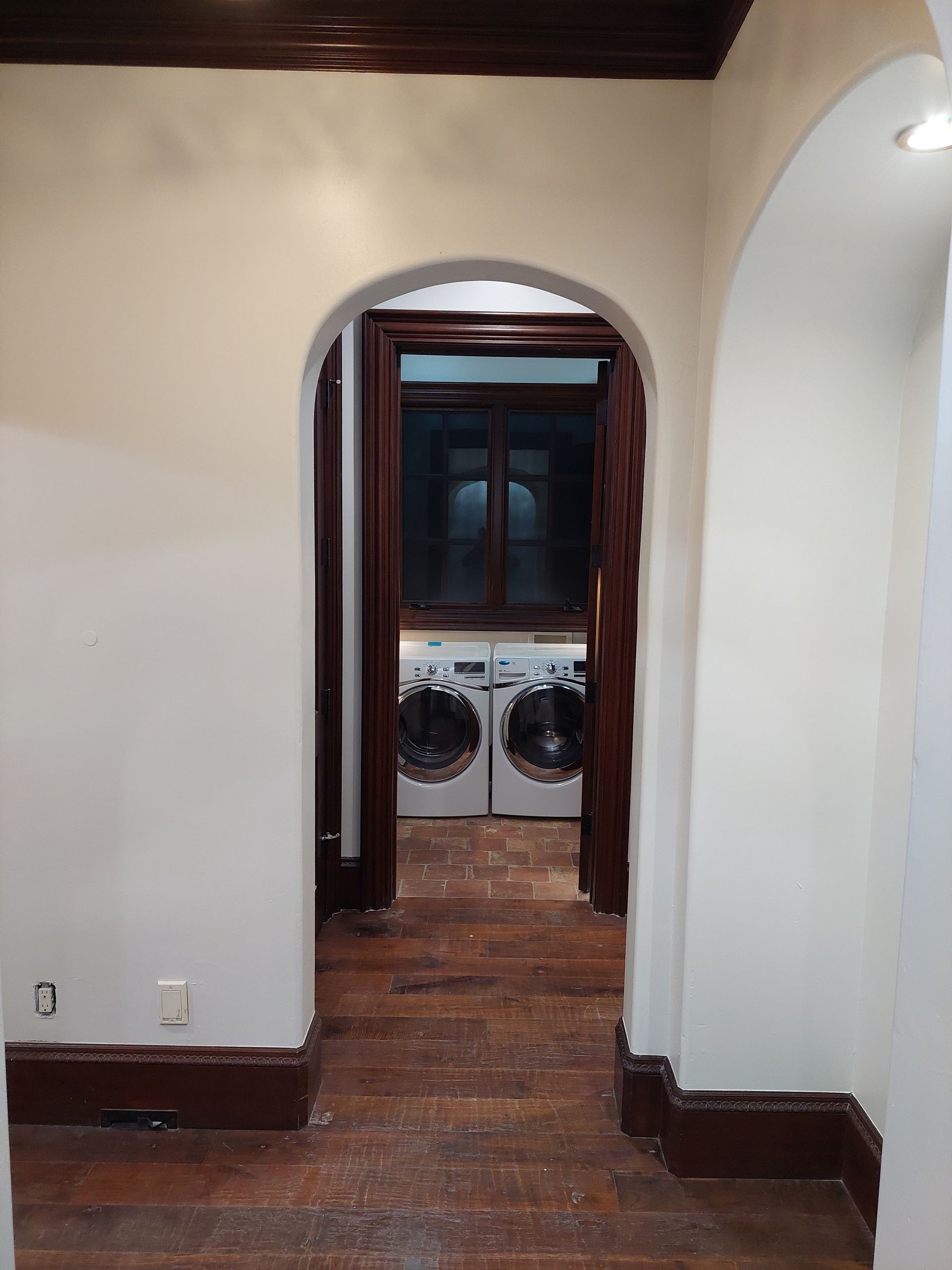 a toilet is sitting in a small bathroom next to a door .