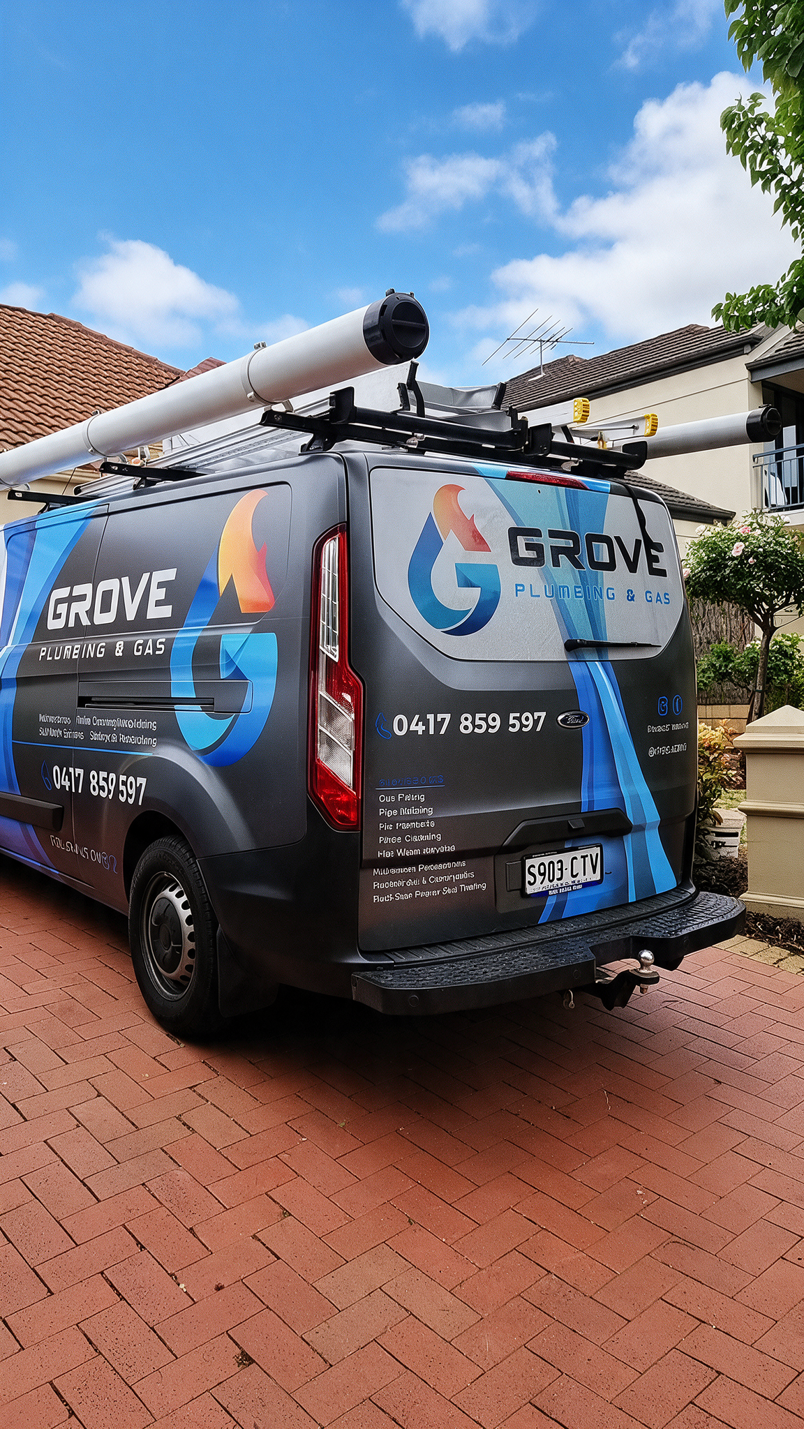 Branded service van with roof-mounted equipment parked on a red brick street under a blue sky