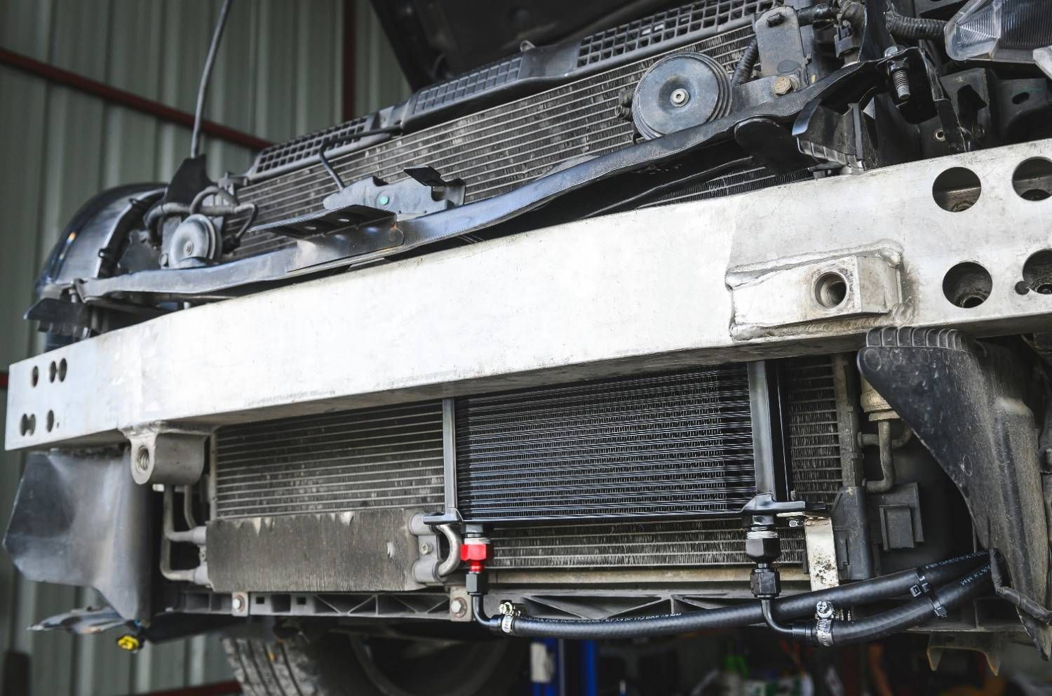 A Car Radiator is Being Removed — Neilsen's Radiator Service in Toowoomba City, QLD