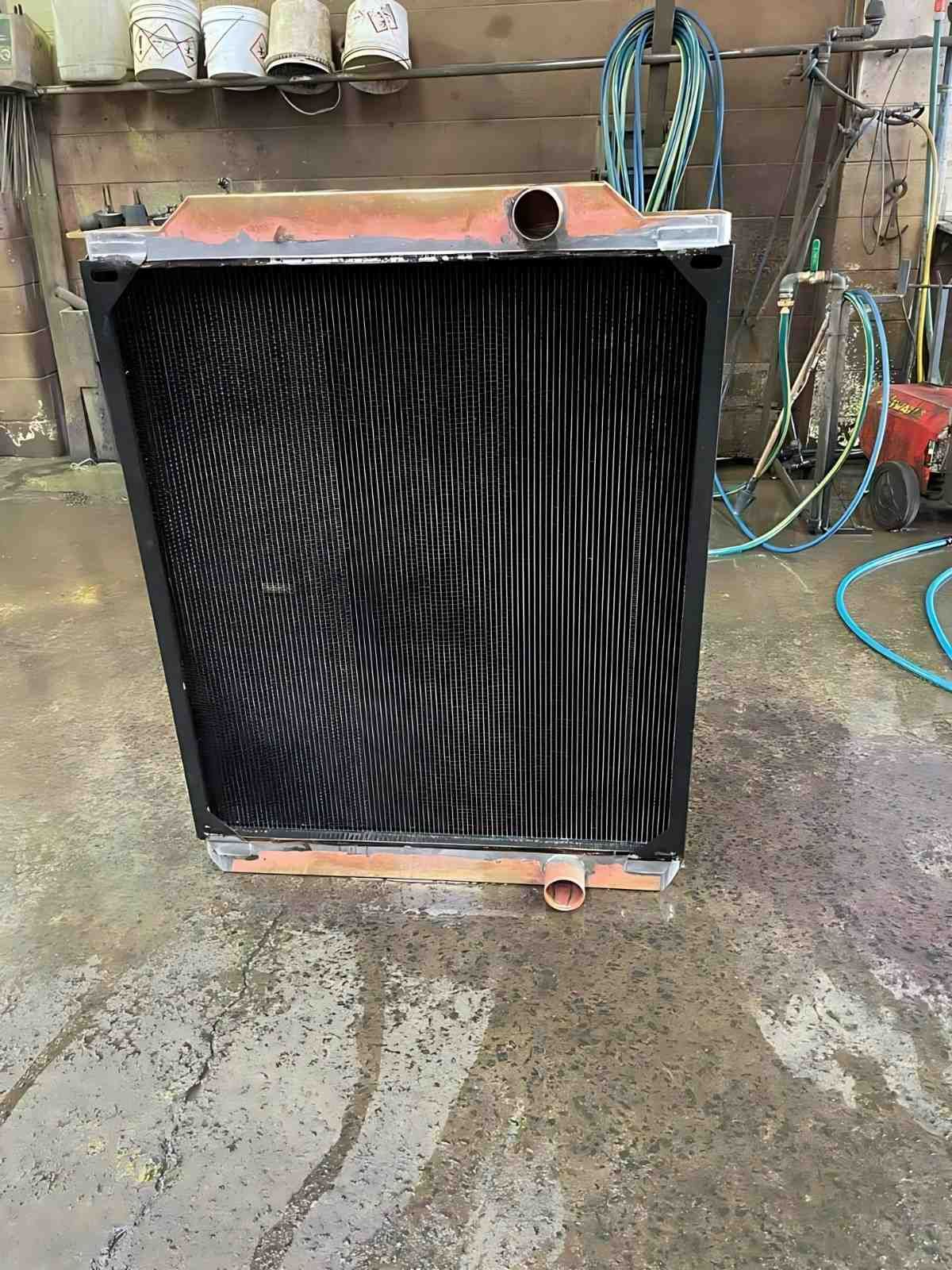 A Radiator is Sitting on a Concrete Floor in a Garage — Neilsen's Radiator Service in Toowoomba City, QLD