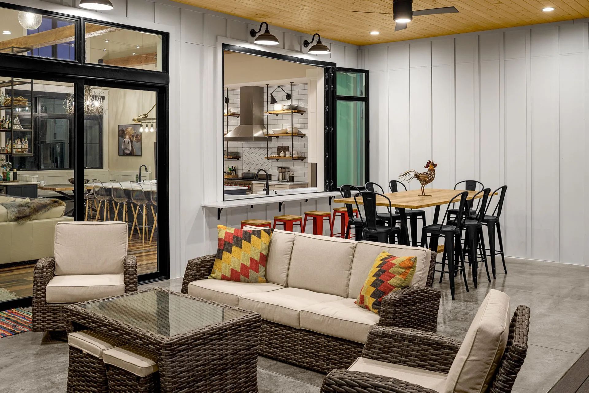 A living room with a couch , chairs , and a table.