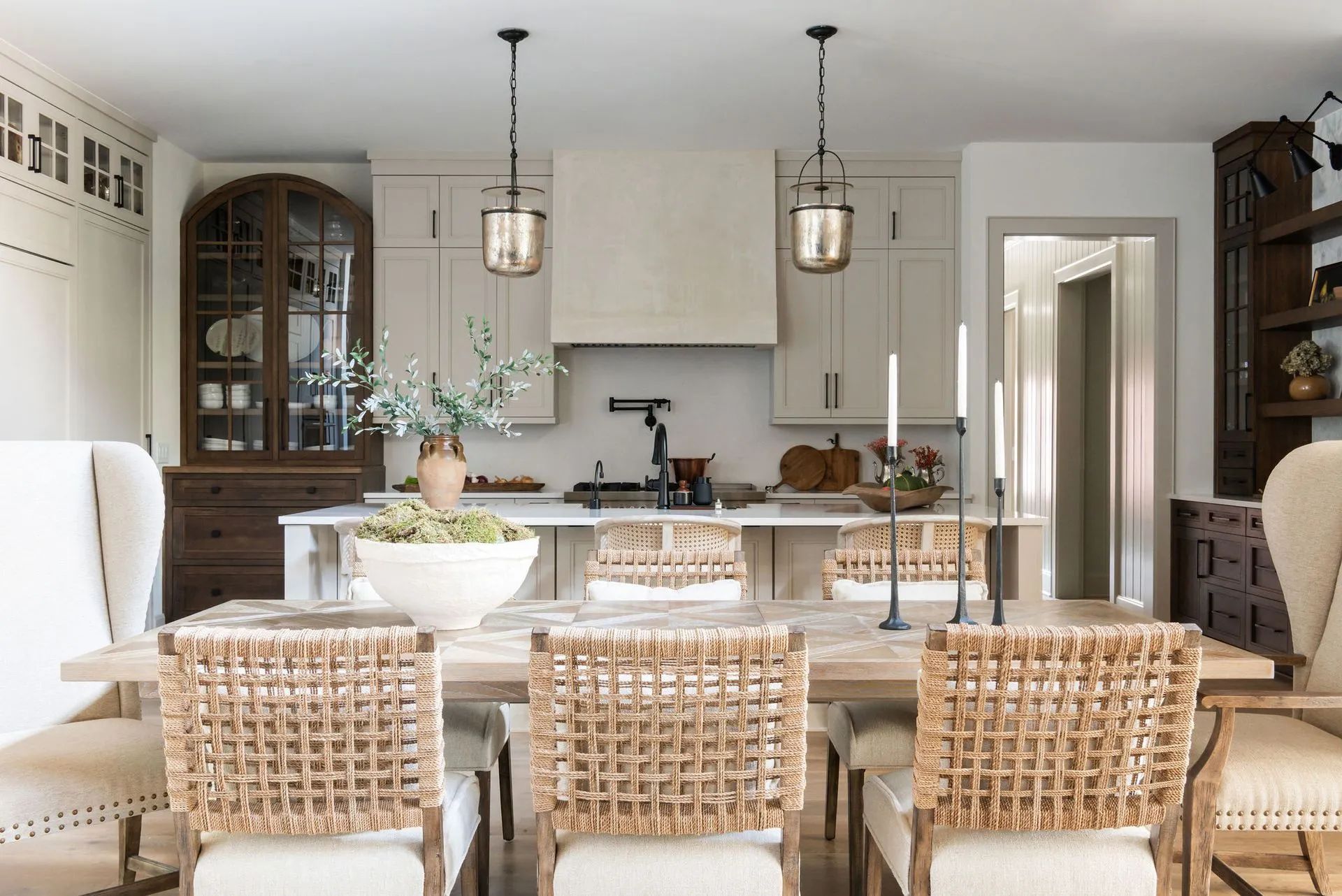 A kitchen with a table and chairs in it